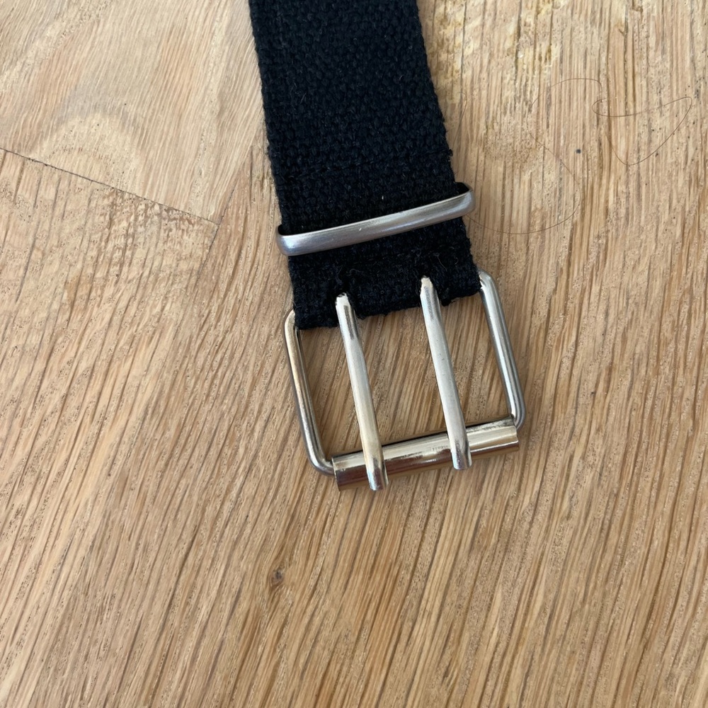 Black and silver studded belt with two holes